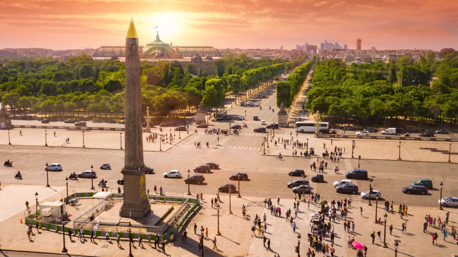 Place de la Concorde with Louxor obelisk and people at sunrise. Paris, France