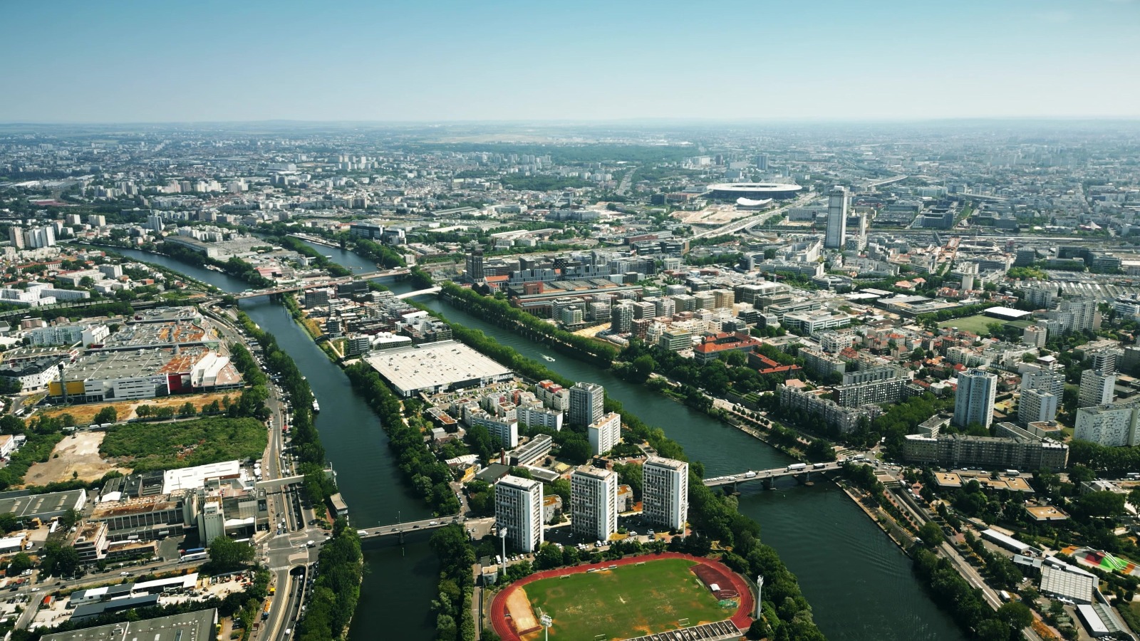 Aerial view of Saint-Denis involving the Seine River and famous Stade de France stadium to the north of Paris, France