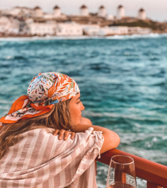 Mykonos - girl looking out to sea