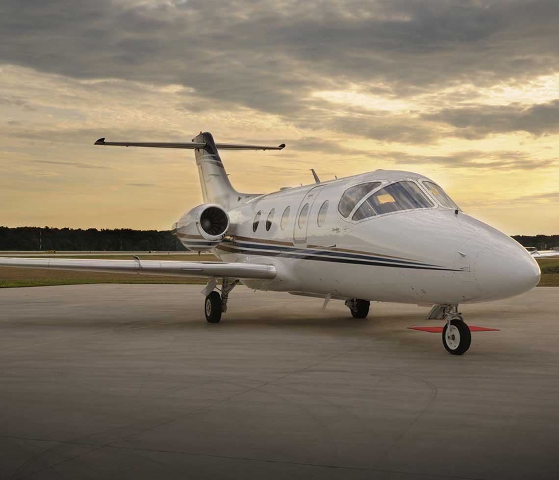 Hawker 400XP private jet on runway