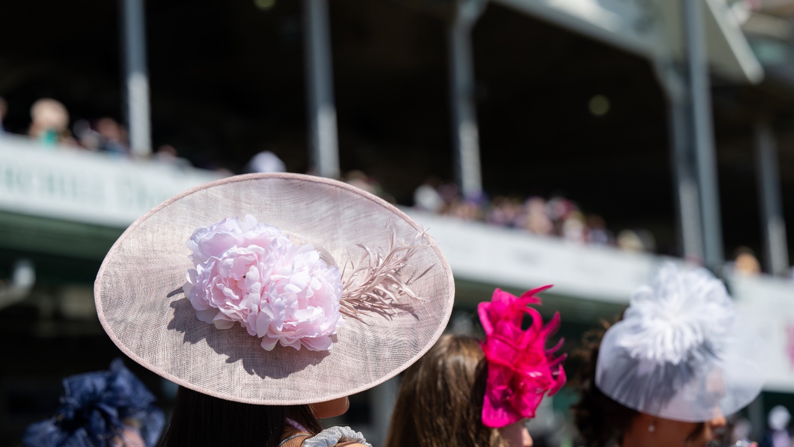 Elegant hats and fancy attire at the horse races